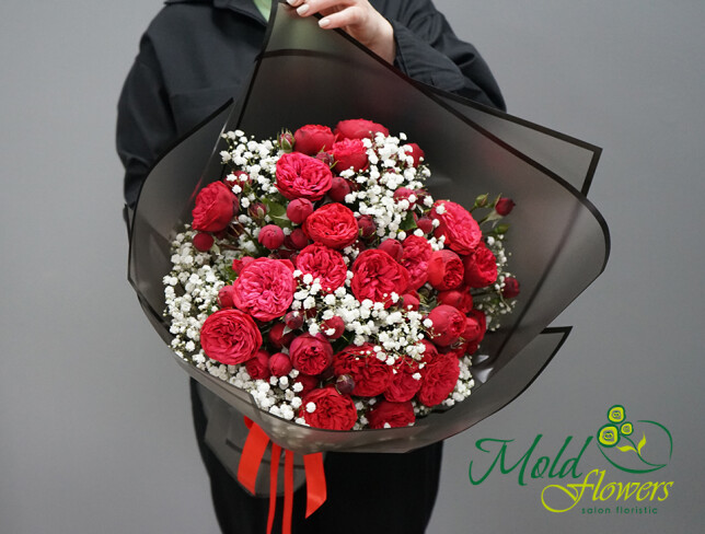 Bouquet of red peony roses and white gypsophila photo